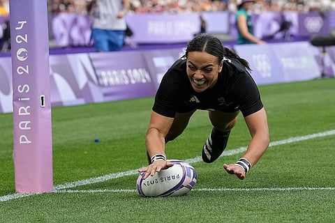New Zealand's Stacey Waaka dives over the line to score a try
